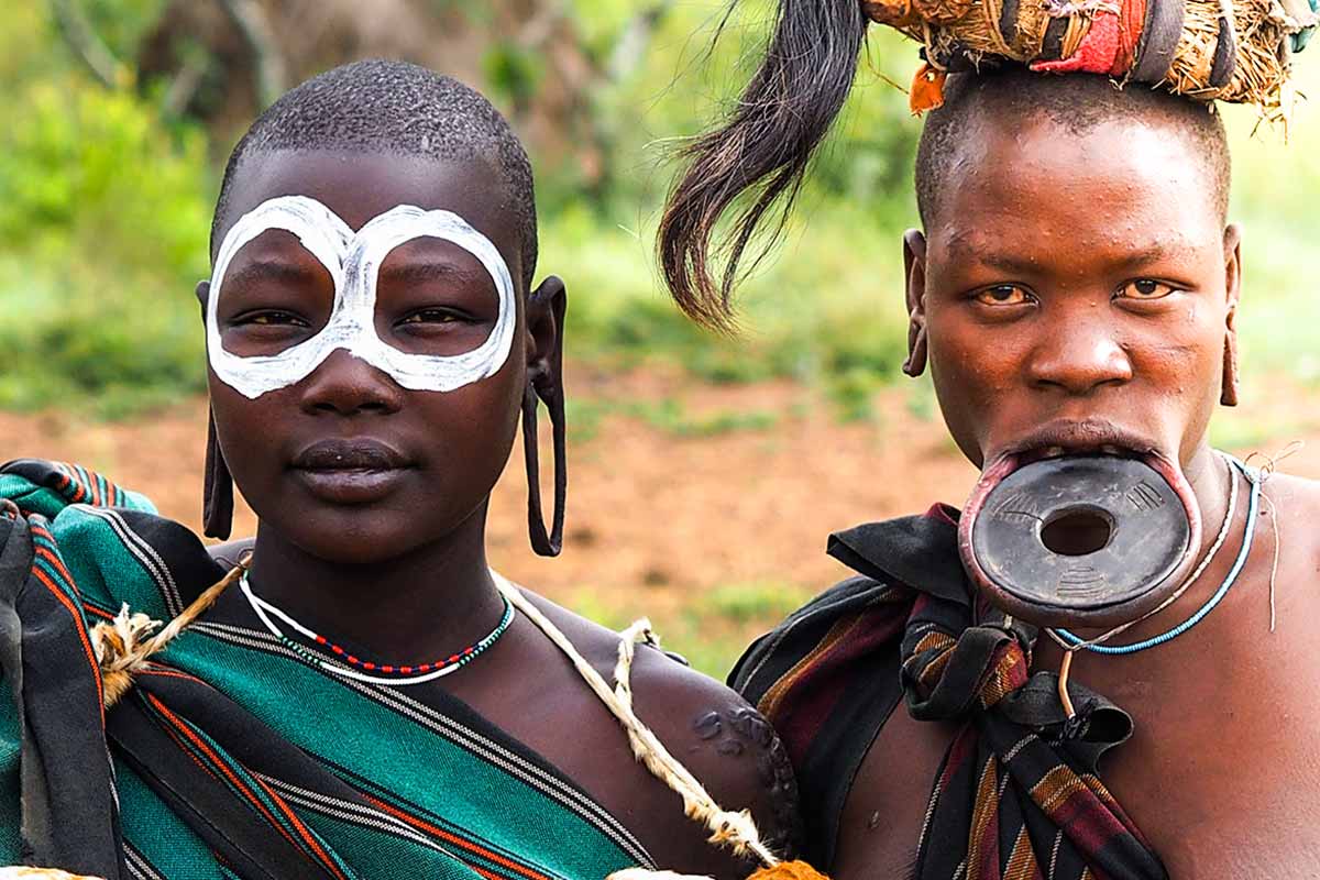 Mursi_Girl_And_Mom Mursi girl and her mother with a lip plate