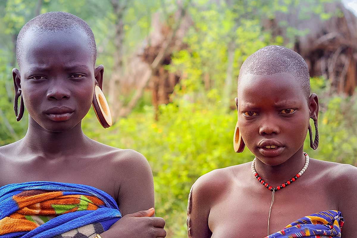 Mursi_Girls Beautiful young girls of the Mursi tribe who have chosen not to partake of the lip plate practice
