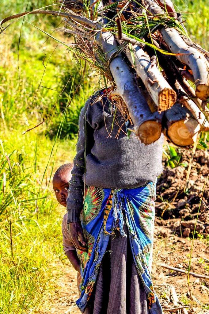 Zimbabwe visa requirements Young boy peeking out from behind his mums skirts in Chimanimani, Zimbabwe