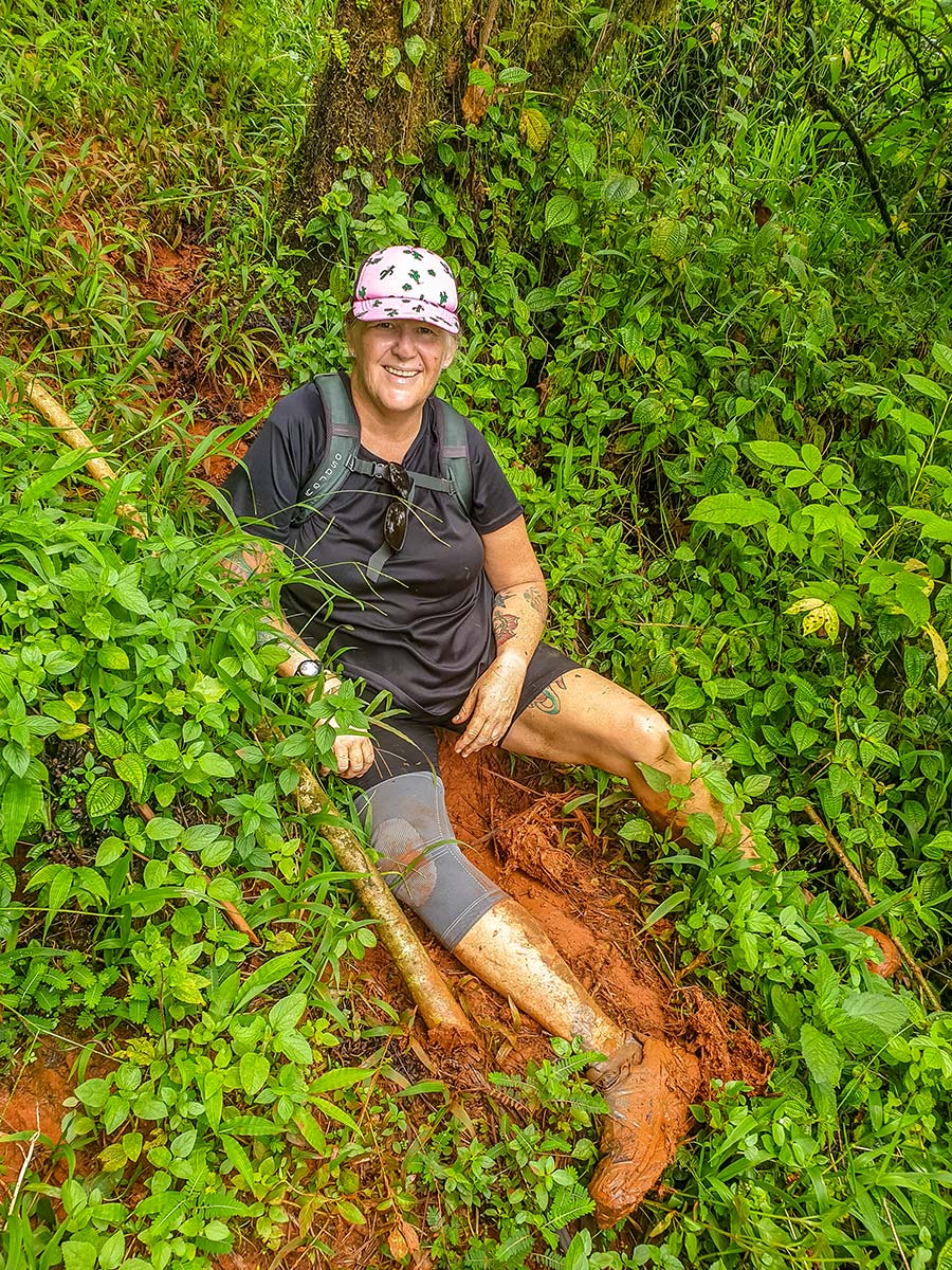 Jen hiking in the very slippery mud in Sanoa