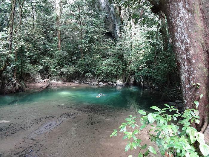 Swimming in the crystal clear wates of Gunung Mulu National Park, Borneo