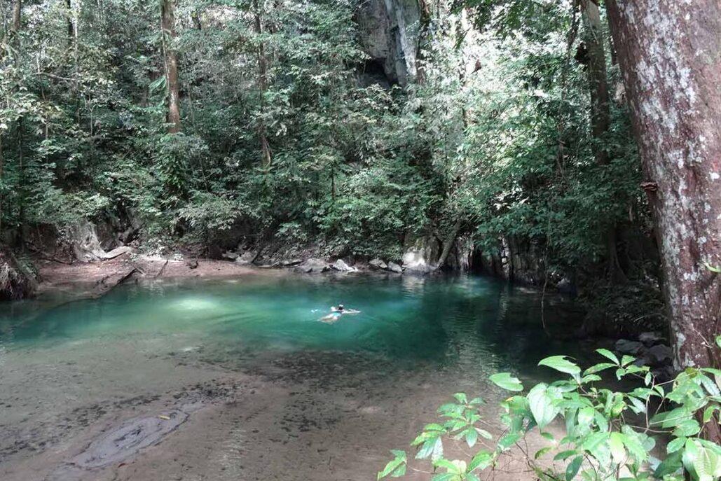 Swimming in the crystal clear waters in Mulu National Park