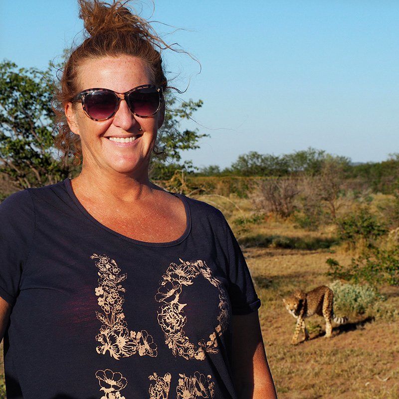 Jen looking happy albeit being stalked by a Cheetah